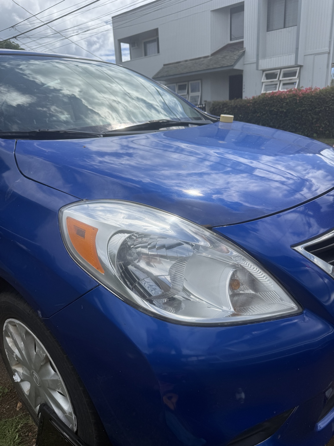 Clear blue Nissan headlight after restoration, angle one
